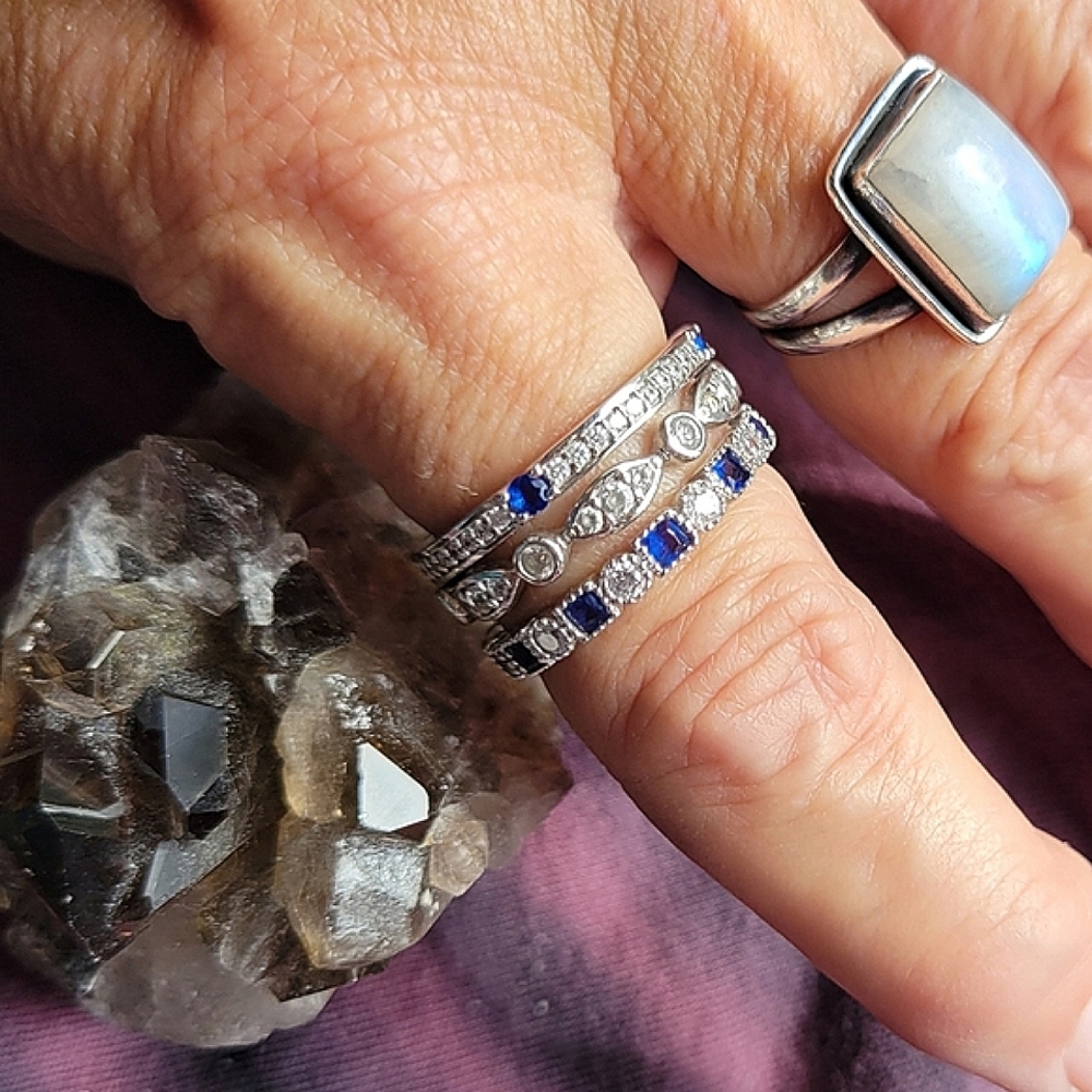 Stack of 3 sterling silver rings, size 9, with cubic zirconia stones.
